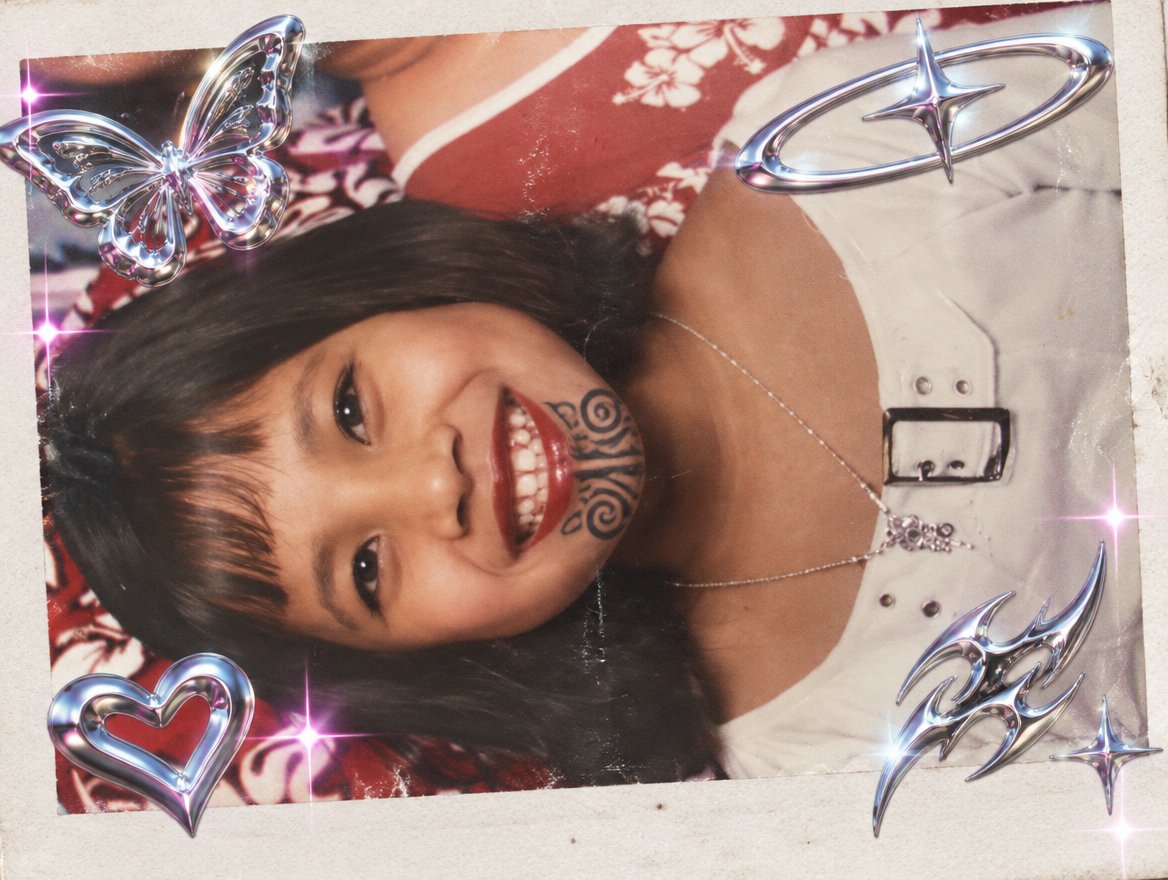 A smiling person in a patterned top with heart and butterfly decorations, glossy photo style.